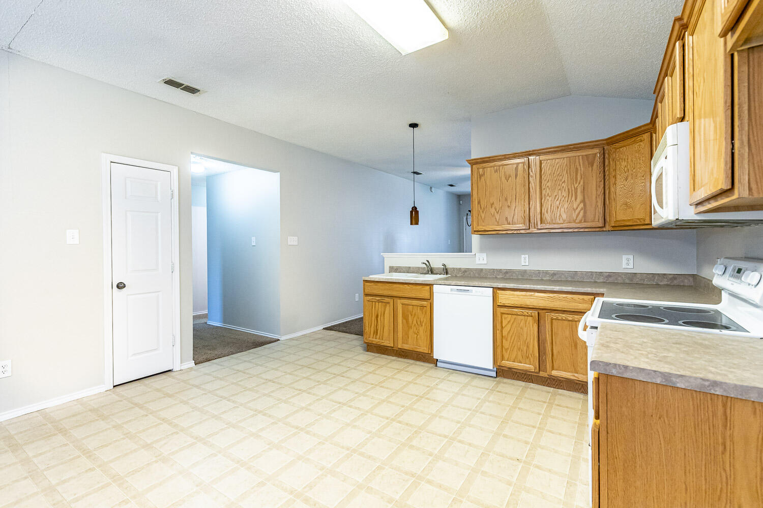 538 North Kirby Avenue Lubbock, TX 79416 - Photo 14 of 22 a kitchen with stainless steel appliances granite countertop a sink a stove cabinets and a window