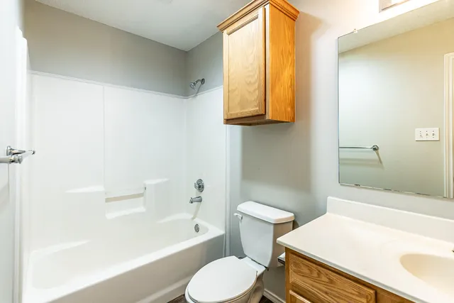 a bathroom with a sink toilet and bathtub