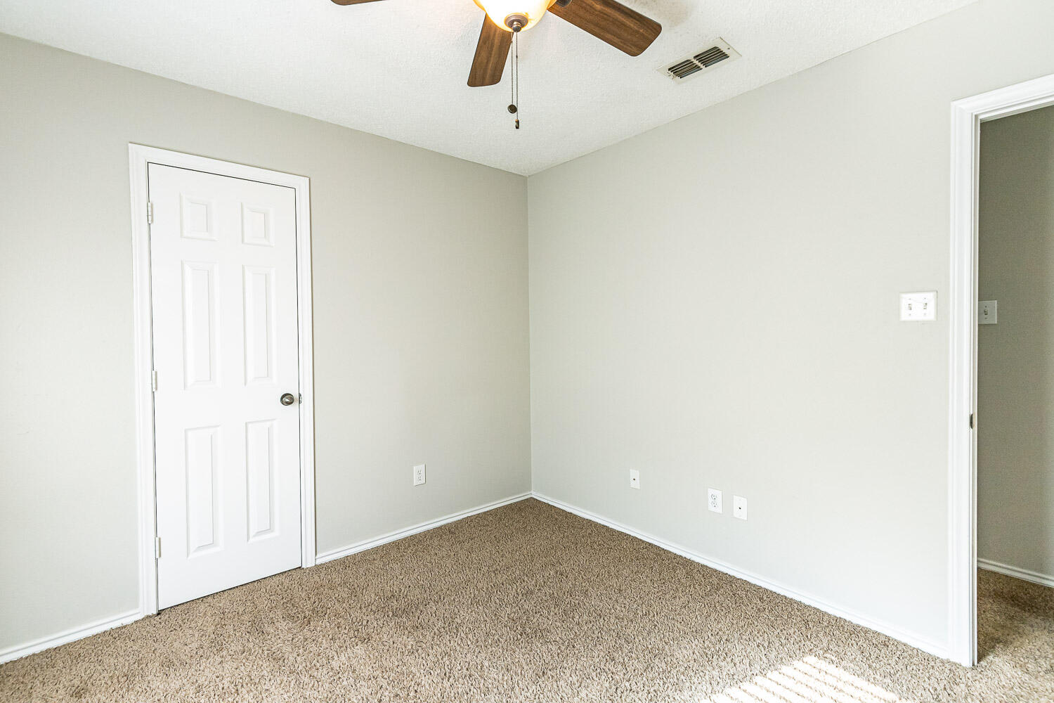 538 North Kirby Avenue Lubbock, TX 79416 - Photo 22 of 22 an empty room with a ceiling fan and carpet