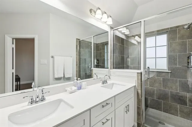 a bedroom with a bed and flat screen tv