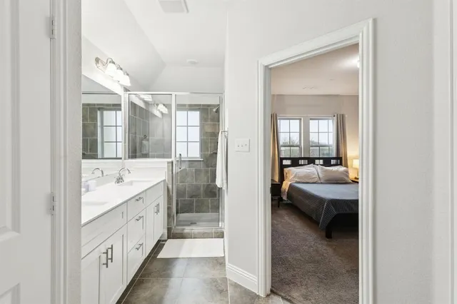 a bathroom with a double vanity sink mirror and double