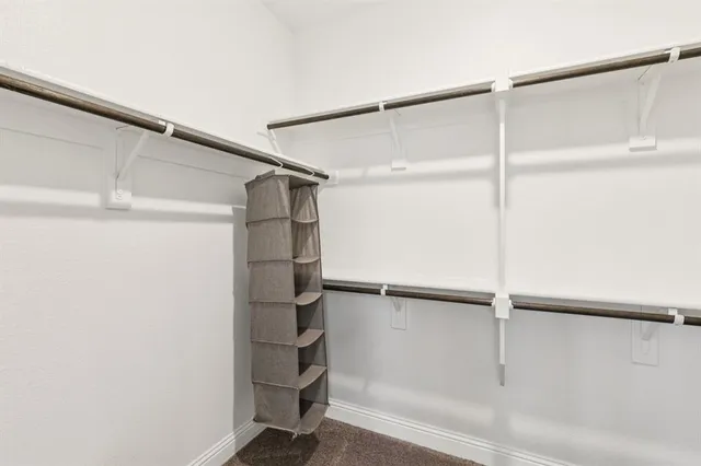 a en suite bathroom with a sink a mirror and shower