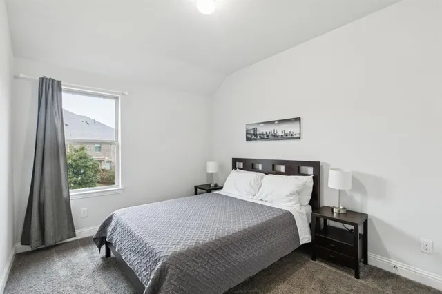 a bedroom with a bed and a closet