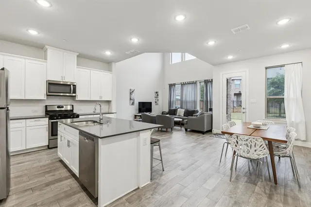 a view of a house with wooden fence