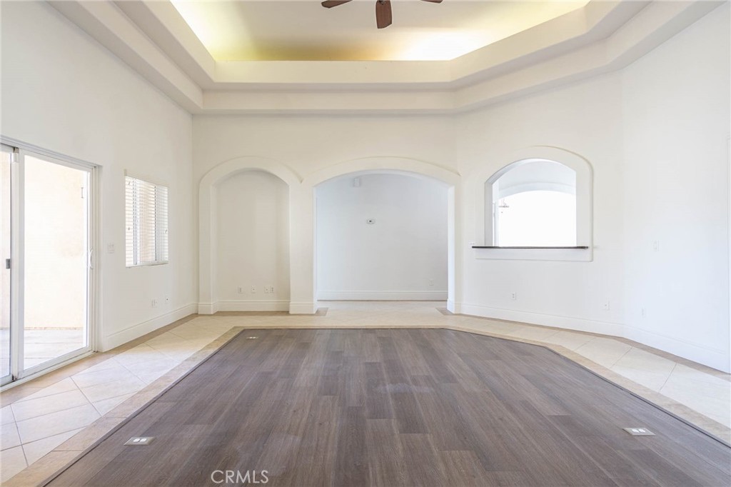 16233 Ridge View Drive Apple Valley, CA 92307 - Photo 17 of 50 an empty room with wooden floor and windows