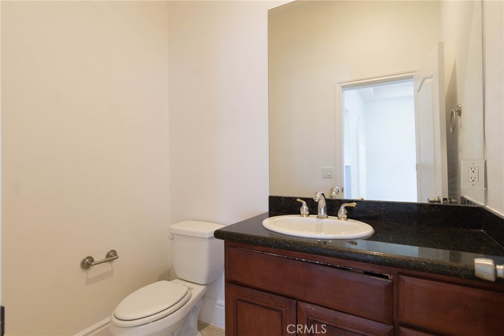 16233 Ridge View Drive Apple Valley, CA 92307 - Photo 18 of 50 a bathroom with a sink and a toilet