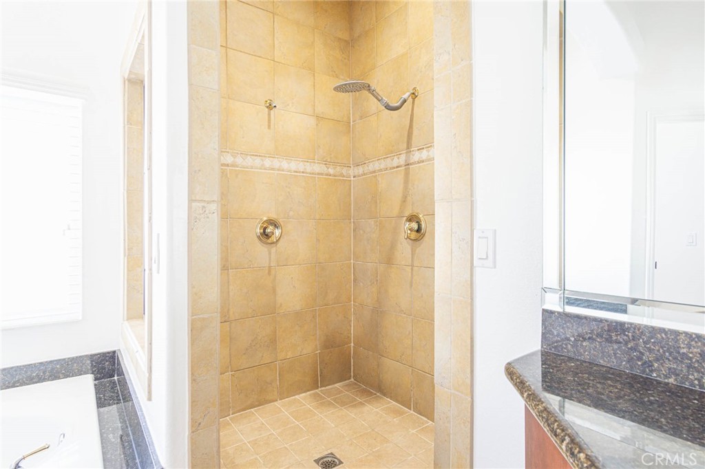 16233 Ridge View Drive Apple Valley, CA 92307 - Photo 24 of 50 a bathroom with a granite countertop shower