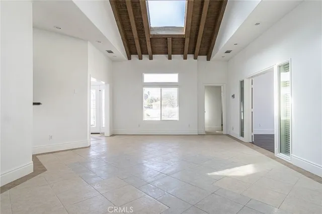 a view of a livingroom with an empty space and window