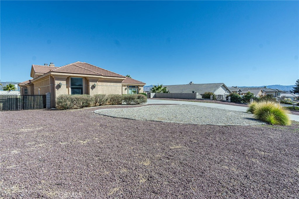 16233 Ridge View Drive Apple Valley, CA 92307 - Photo 41 of 50 a front view of a house with a yard