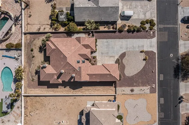 an aerial view of a house with a swimming pool