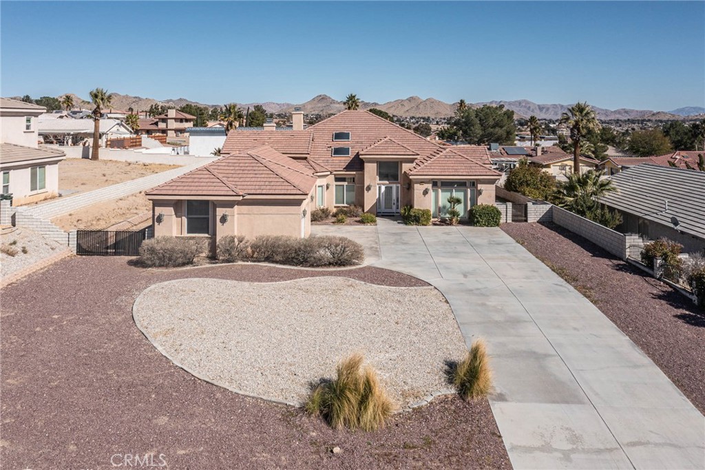 16233 Ridge View Drive Apple Valley, CA 92307 - Photo 48 of 50 a front view of a house with a yard