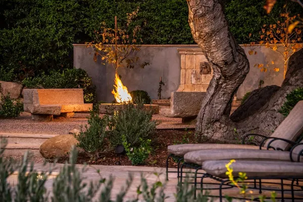 an aerial view of a house with a yard basket ball court and outdoor seating