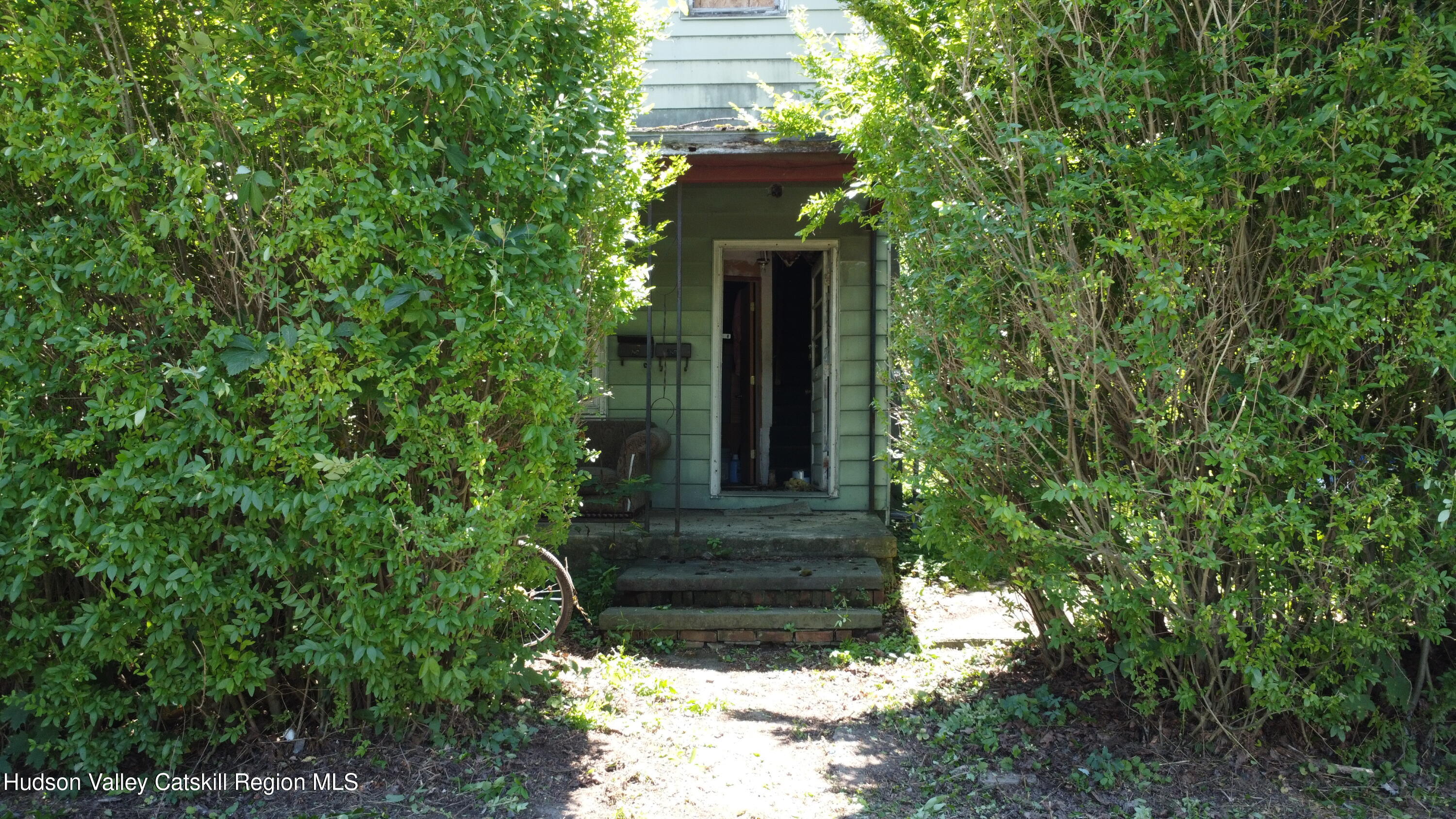67 West Bridge Street Catskill, NY 12414 - Photo 2 of 6 a front view of a house with a yard