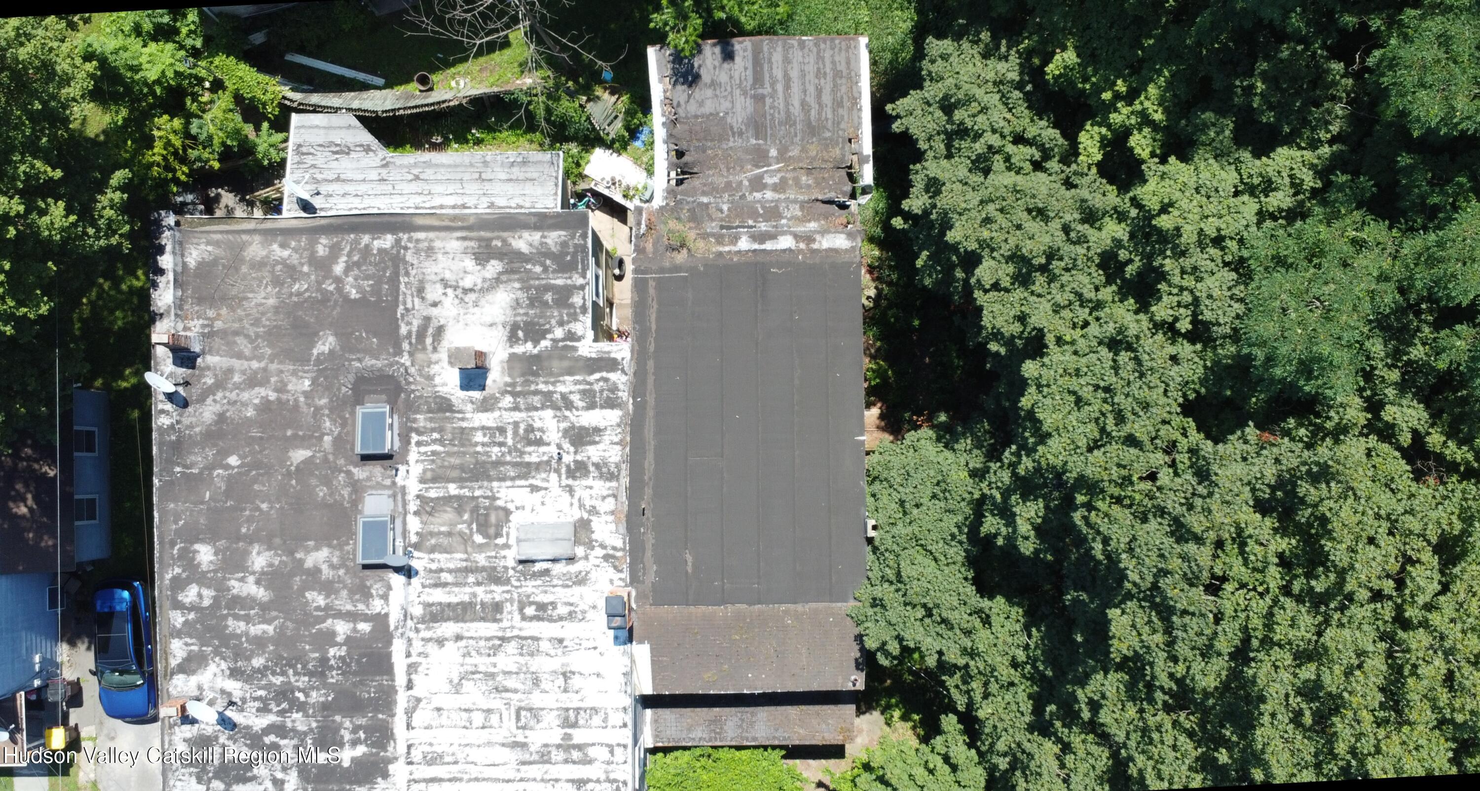 67 West Bridge Street Catskill, NY 12414 - Photo 6 of 6 an aerial view of residential house with outdoor space and trees all around