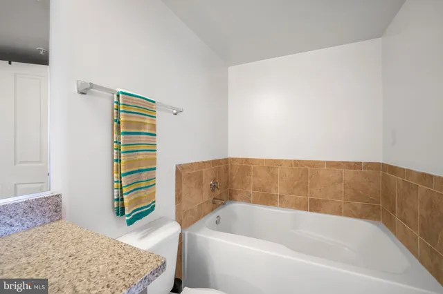 a bathroom with a bathtub and shower