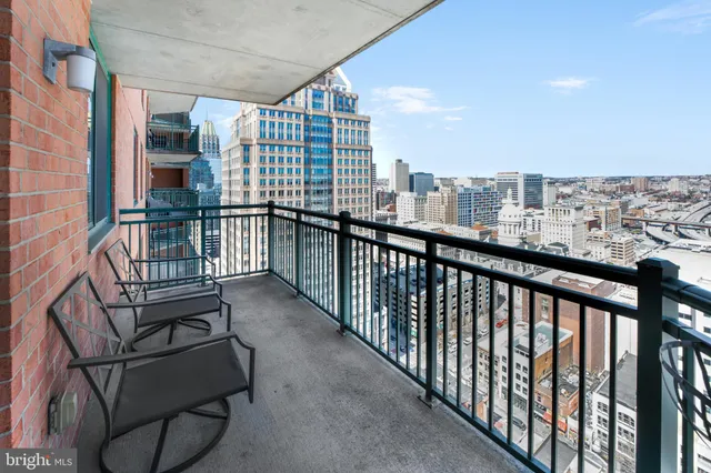 a view of a balcony with furniture