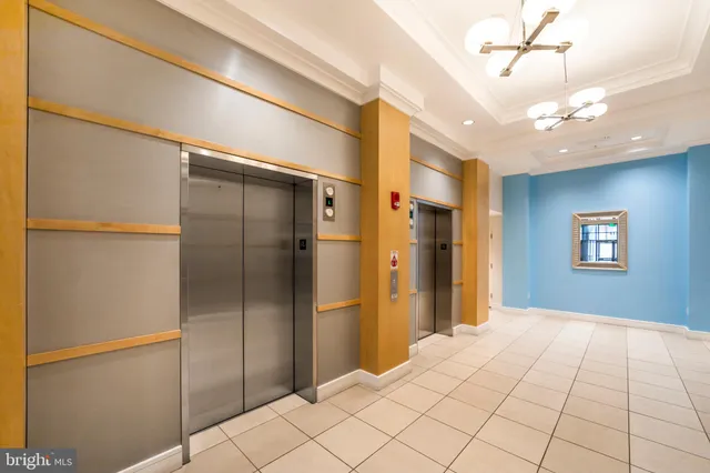 a living room with furniture flat screen tv and wooden floor