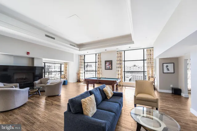 a living room with fireplace furniture and a flat screen tv