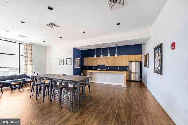 a view of a dining room with furniture and a window