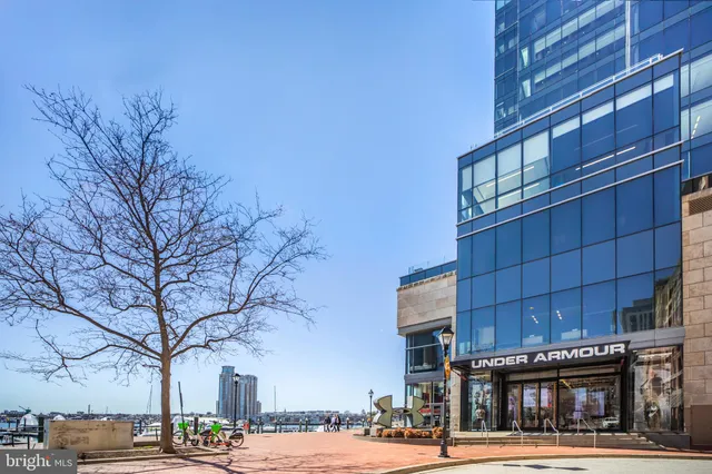 a view of a lake with boats and a bridge
