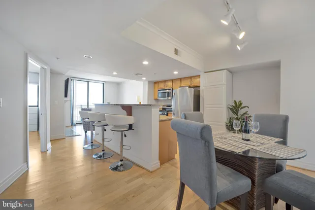 a view of a dining room with furniture and wooden floor
