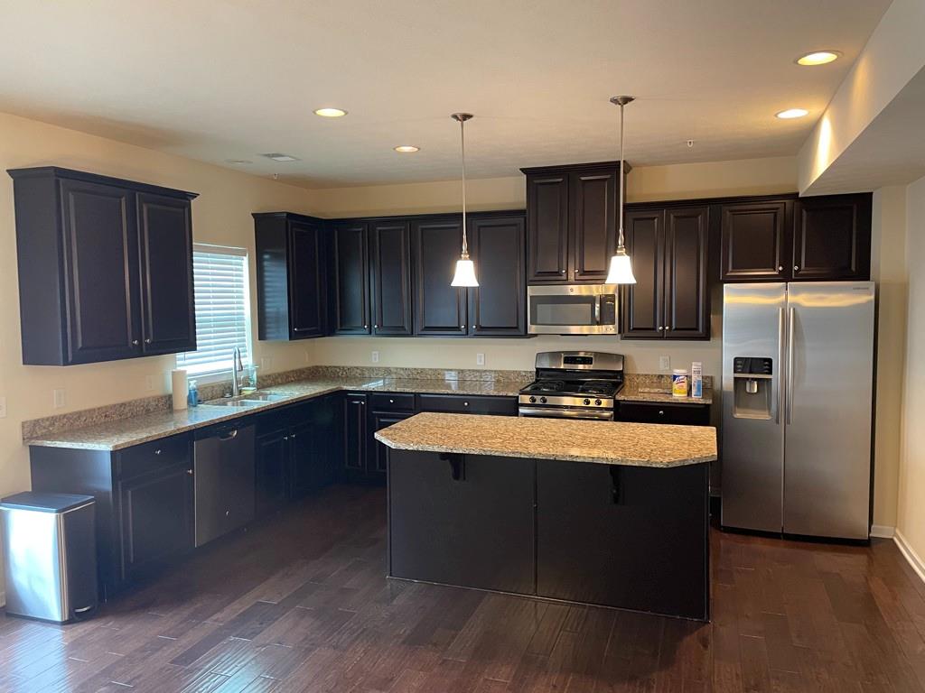 617 Broadmore Lane Wexford, PA 15090 - Photo 14 of 36 a kitchen with stainless steel appliances granite countertop a sink a stove a refrigerator and cabinets