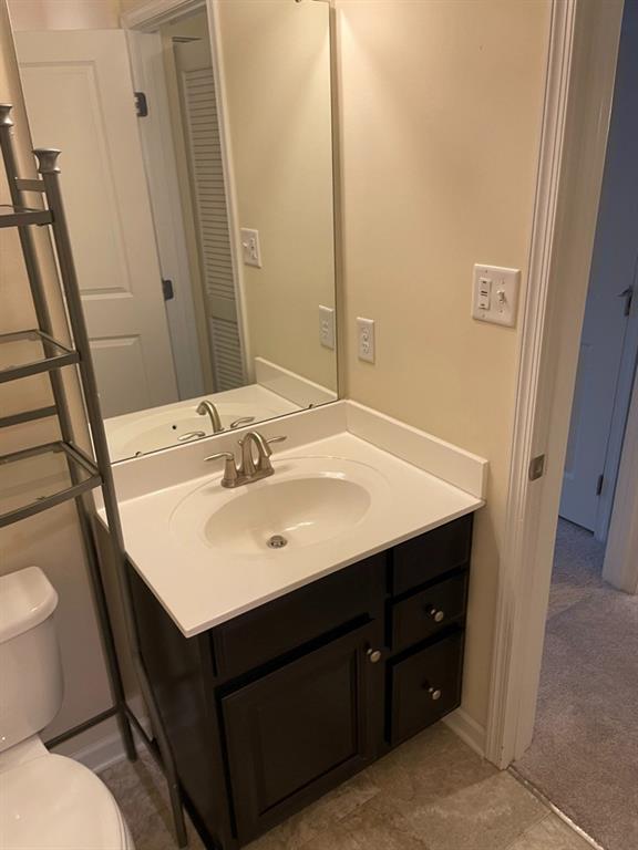 617 Broadmore Lane Wexford, PA 15090 - Photo 26 of 36 a bathroom with a sink a toilet a mirror and vanity