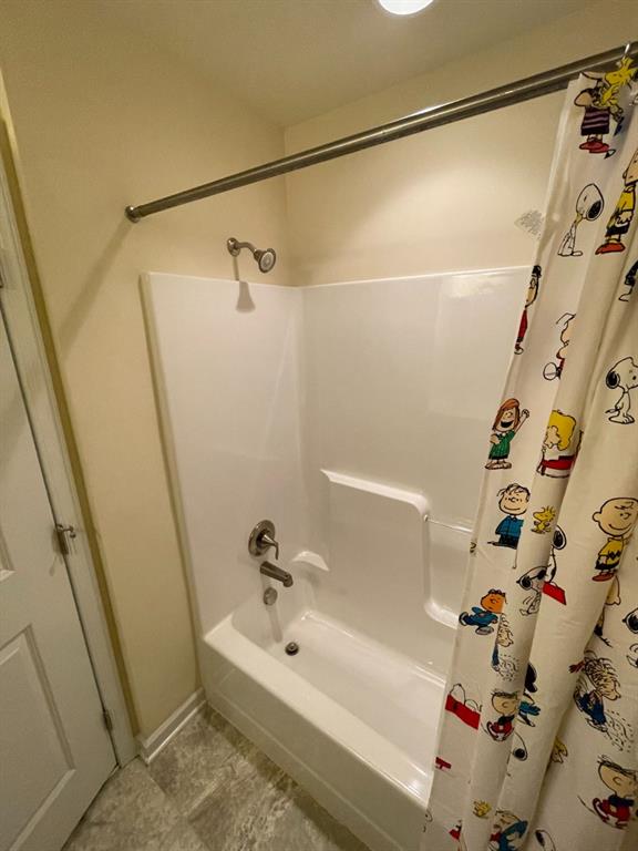 617 Broadmore Lane Wexford, PA 15090 - Photo 27 of 36 a bathroom with a bathtub and a shower