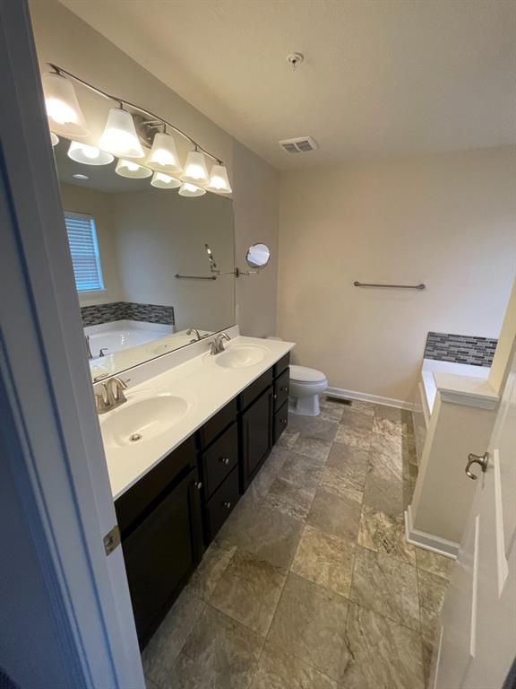 617 Broadmore Lane Wexford, PA 15090 - Photo 32 of 36 a bathroom with a sink vanity and mirror
