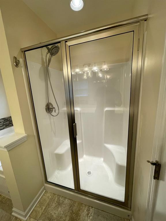 617 Broadmore Lane Wexford, PA 15090 - Photo 34 of 36 a bathroom with a glass shower door