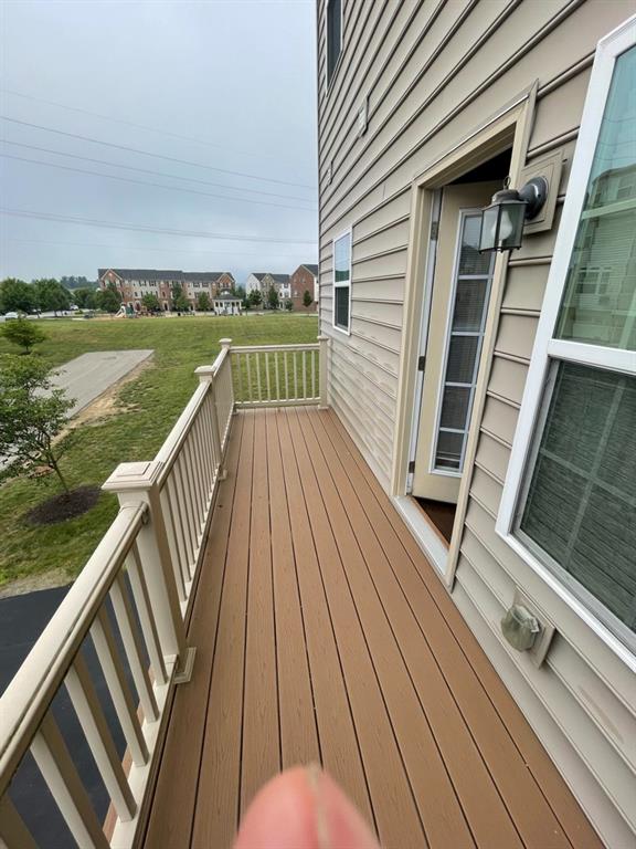 617 Broadmore Lane Wexford, PA 15090 - Photo 4 of 36 a view of balcony with wooden floor and lake view