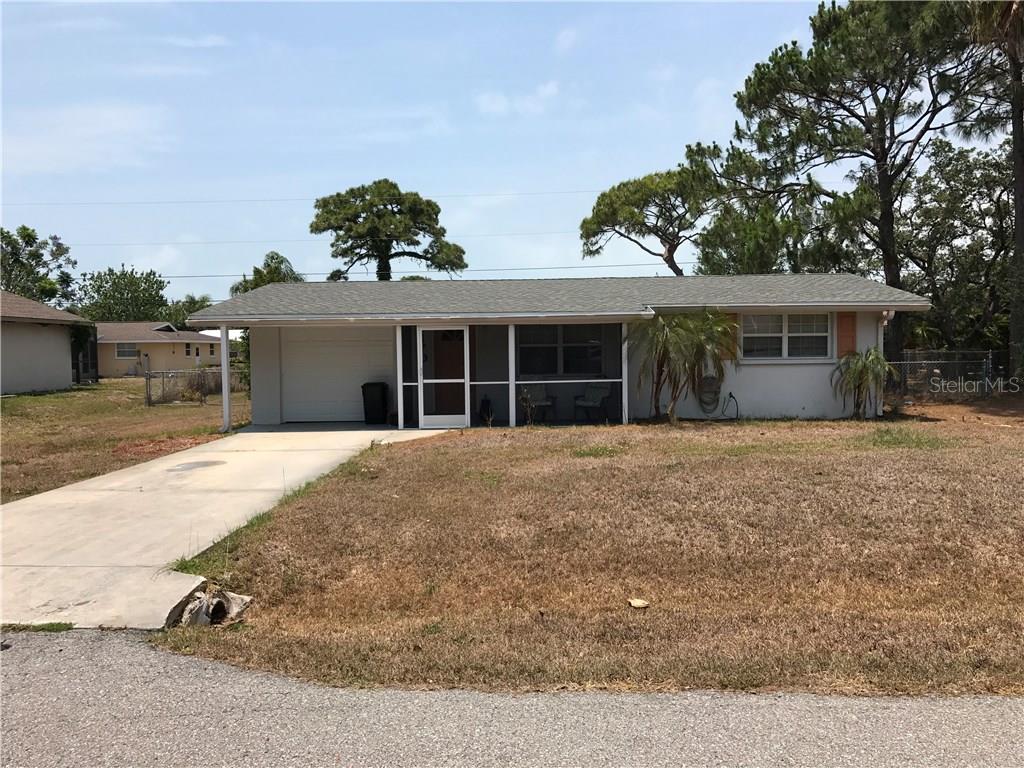 1170 Fundy Road Venice, FL 34293 - Photo 1 of 1 front view of a house with a yard