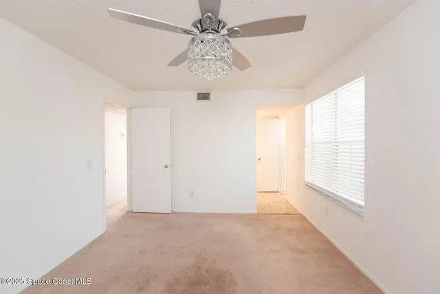 a bathroom with a toilet a sink a vanity and mirror