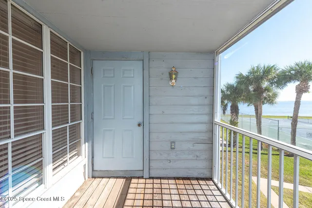 a view of balcony with furniture