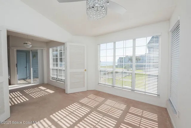 a view of a room with a large window