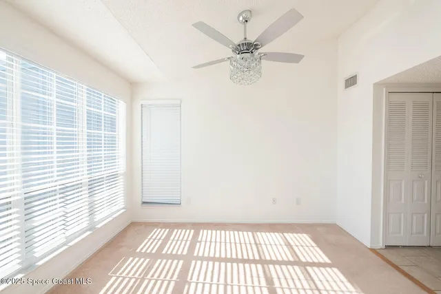 a kitchen with a sink toilet and refrigerator