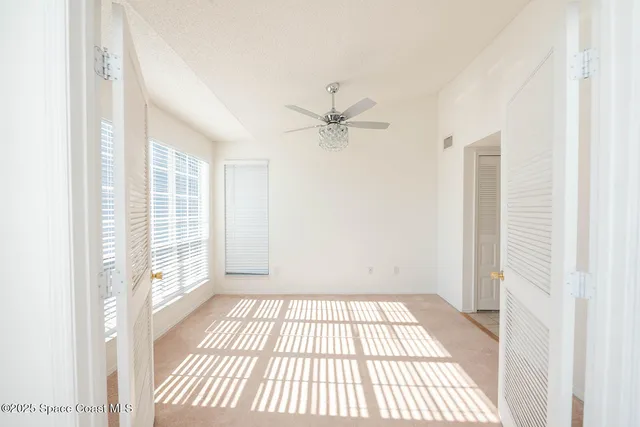 a kitchen with a refrigerator and a stove