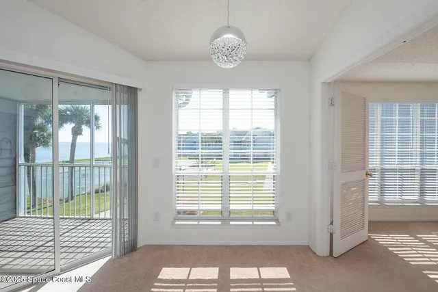 a kitchen with granite countertop a refrigerator and a stove
