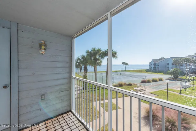 a view of balcony with a swimming pool