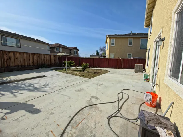 a view of a backyard with furniture and staircase
