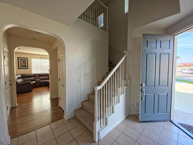 a view of a hallway view with staircase