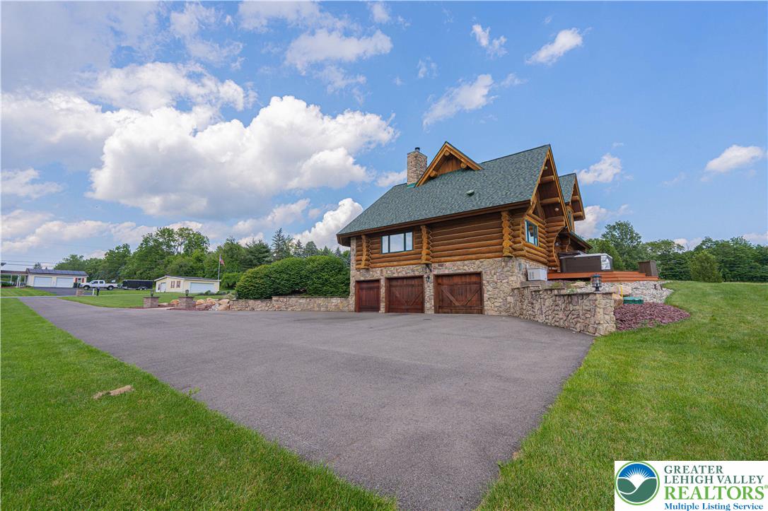 379 Meyer Road Nazareth, PA 18064 - Photo 13 of 78 a view of a house with a yard and a garden