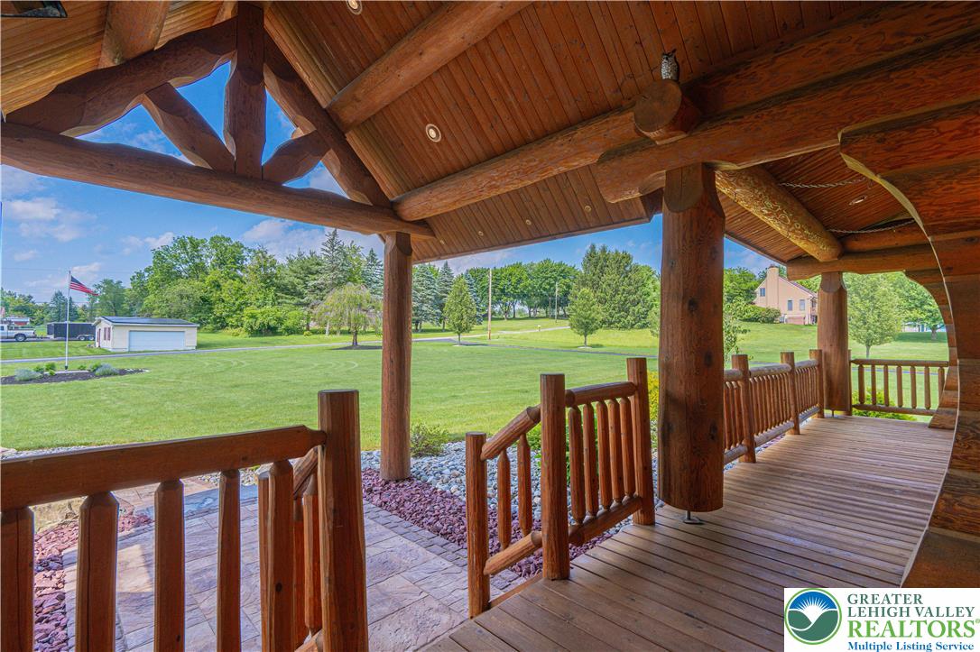 379 Meyer Road Nazareth, PA 18064 - Photo 18 of 78 a view of a deck with wooden floor and roof with a floor to ceiling window next to a yard