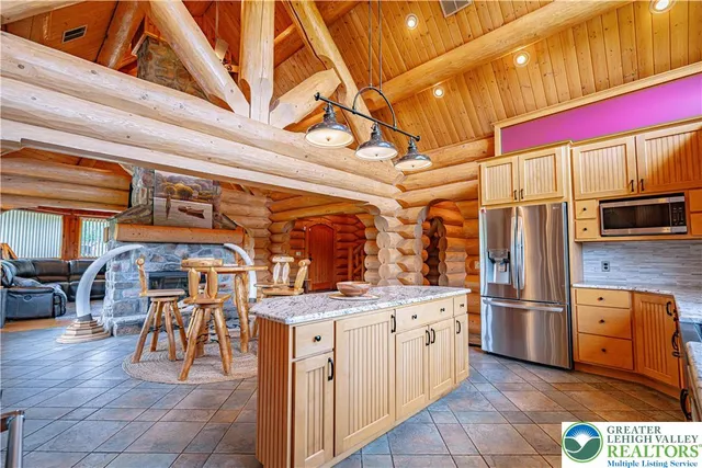 a bedroom with a bed and a view of kitchen