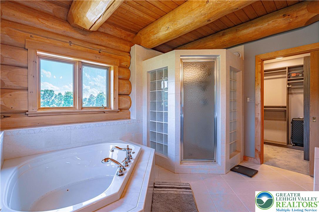 379 Meyer Road Nazareth, PA 18064 - Photo 49 of 78 a bath tub sitting in a bathroom next to a window