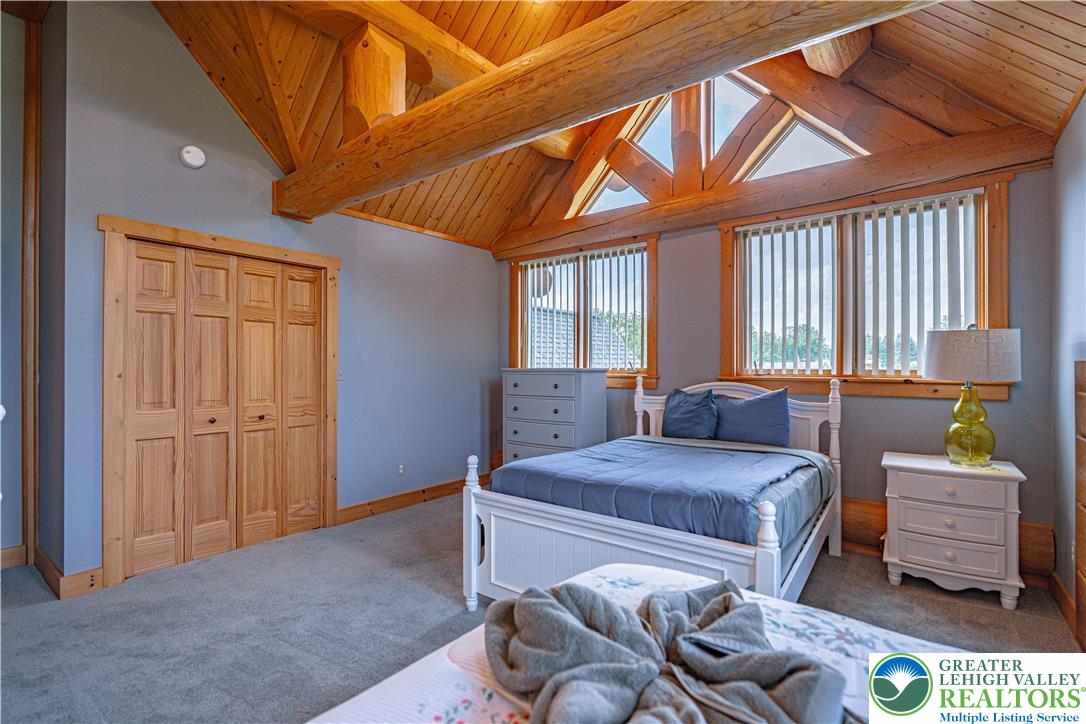 379 Meyer Road Nazareth, PA 18064 - Photo 59 of 78 a bedroom with a bed and a couch