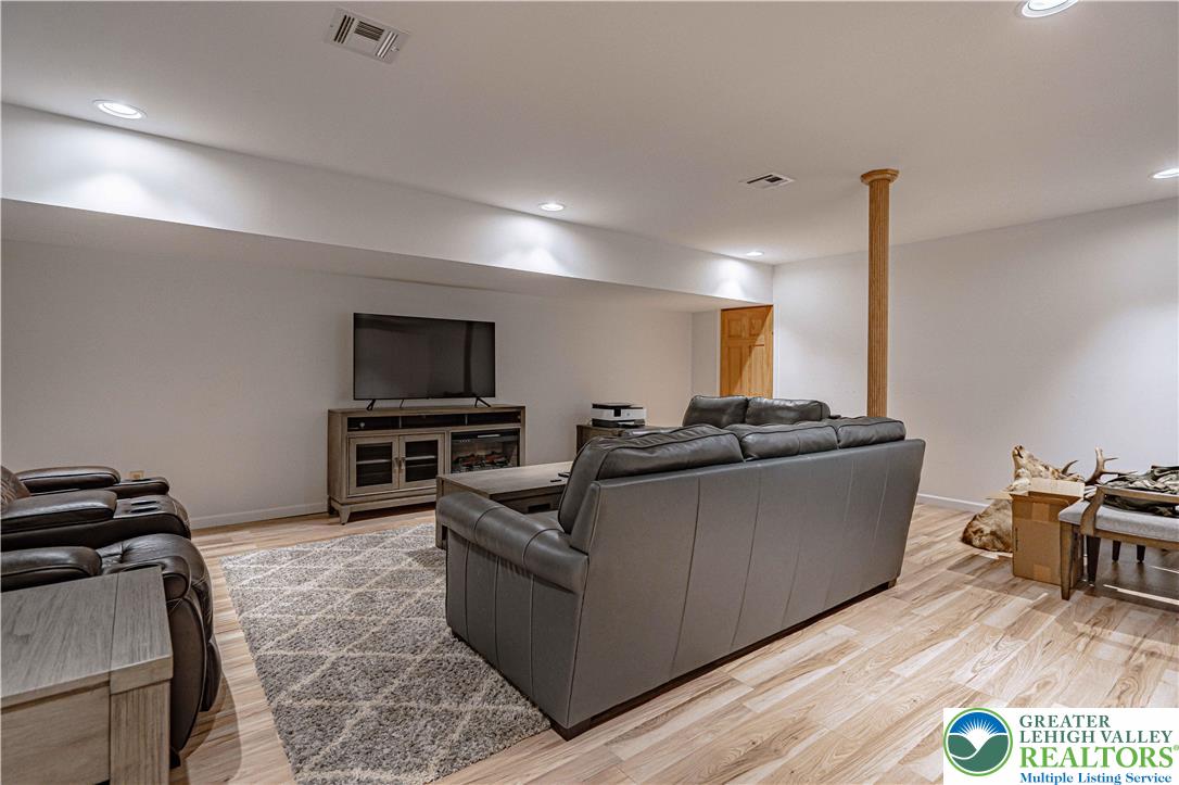 379 Meyer Road Nazareth, PA 18064 - Photo 66 of 78 a living room with furniture and a flat screen tv