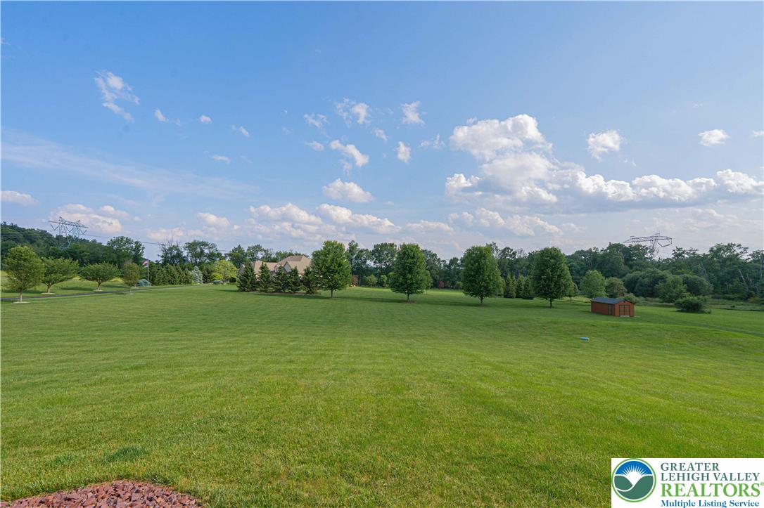 379 Meyer Road Nazareth, PA 18064 - Photo 76 of 78 a view of a golf course with a lake