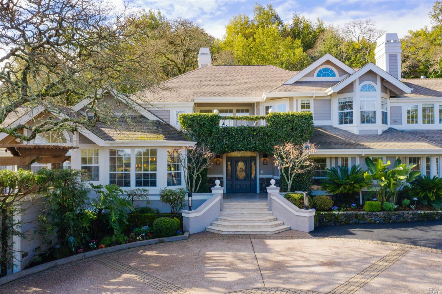 4077 White Alder Sonoma, CA 95476 - Photo 1 of 1 a front view of a house with a yard and potted plants