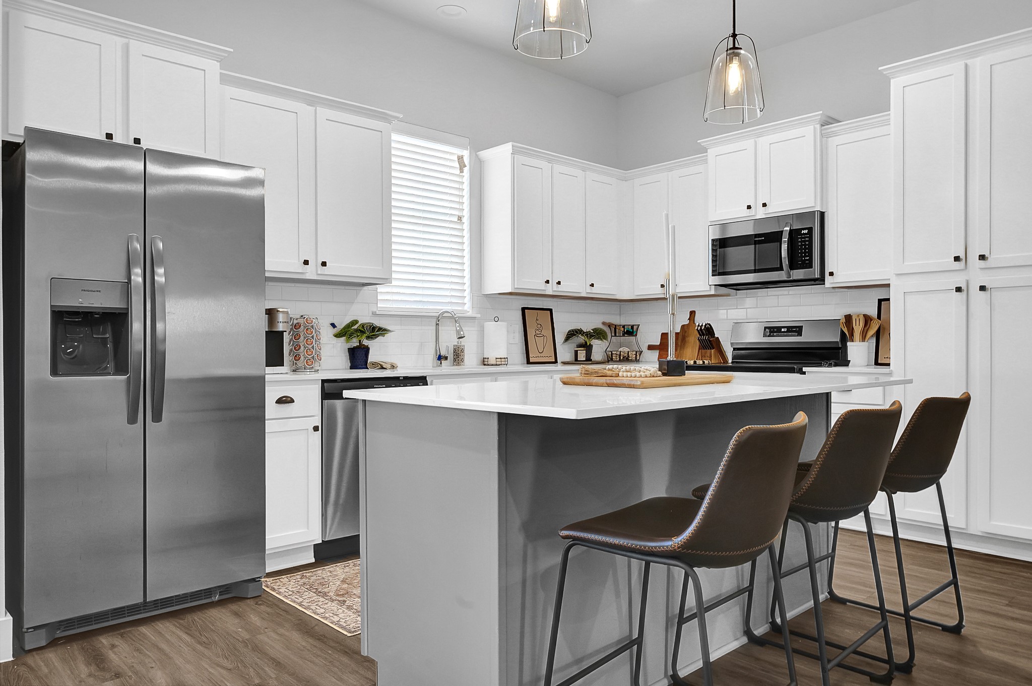 38634 Spur 149 Road, Unit 68A Magnolia, TX 77354 - Photo 8 of 50 a kitchen with stainless steel appliances granite countertop a refrigerator a sink a stove a microwave and wooden cabinets